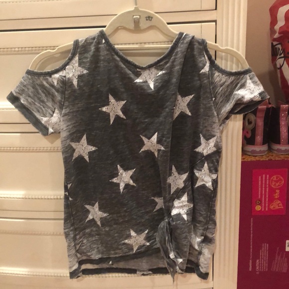 A shirt with a star pattern for females. - Picture 1 of 2